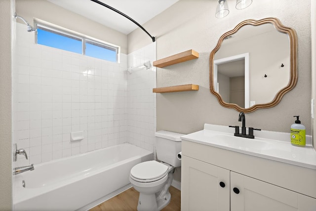 full bath with wood finished floors, toilet, vanity, and  shower combination