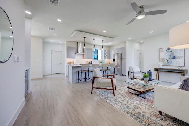 4300 Mansfield Dam Ct Unit 1231, Austin, TX 78734 - living room featuring light wood finished floors, ceiling fan, baseboards, and recessed lighting
