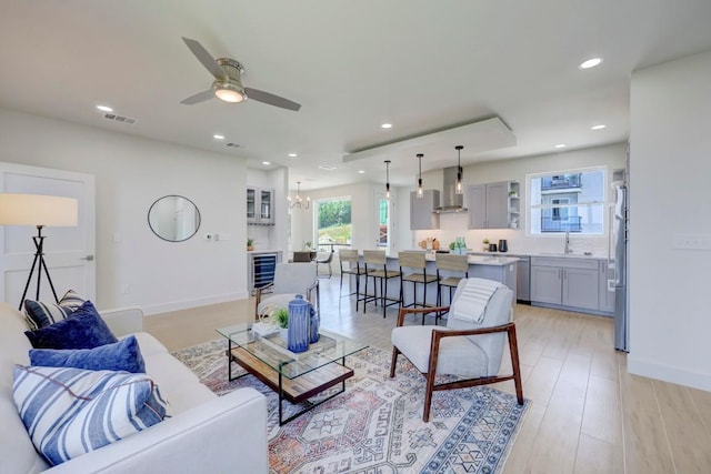 4300 Mansfield Dam Ct Unit 1231, Austin, TX 78734 - living area with a ceiling fan, wine cooler, a chandelier, recessed lighting, and light wood-style flooring