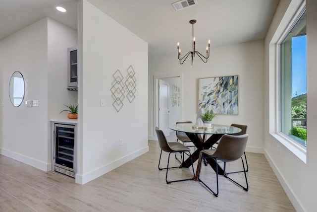 4300 Mansfield Dam Ct Unit 1231, Austin, TX 78734 - dining area with wine cooler, a chandelier, light wood-style flooring, baseboards, and recessed lighting