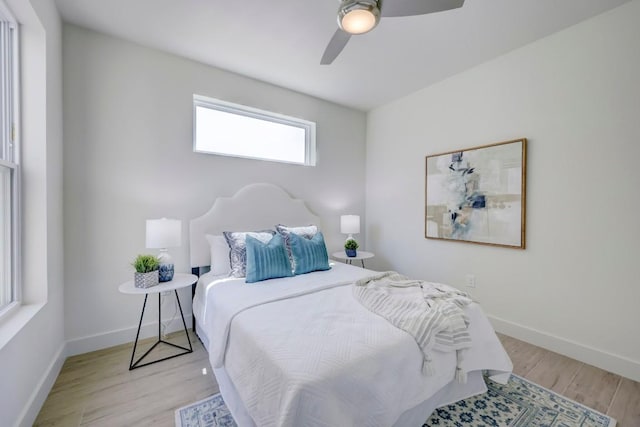 4300 Mansfield Dam Ct Unit 1231, Austin, TX 78734 - bedroom with light wood finished floors, a ceiling fan, and baseboards