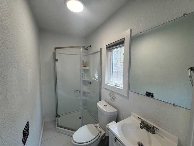 full bathroom with a textured wall, tile patterned flooring, and a stall shower
