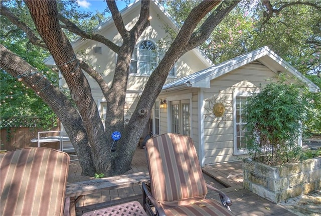 view of property exterior with a deck