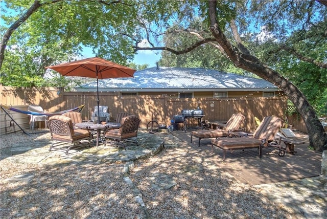 view of patio / terrace featuring fence