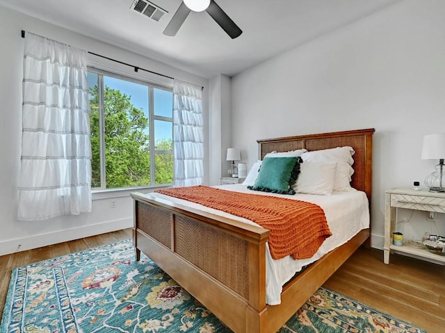 505 Tillery St Unit 6, Austin, TX 78702 - bedroom featuring wood finished floors, ceiling fan, and baseboards