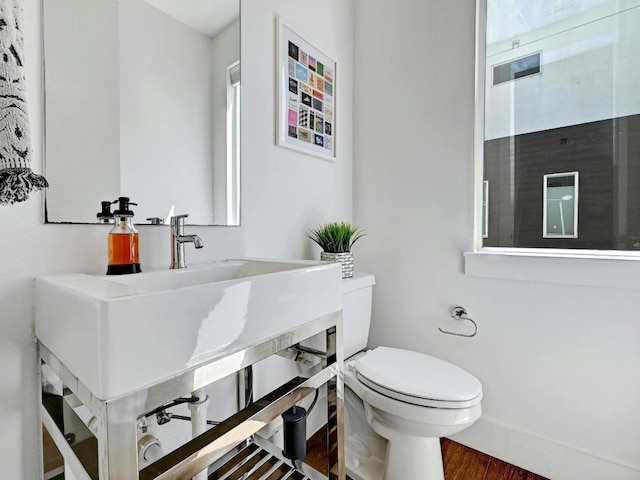505 Tillery St Unit 6, Austin, TX 78702 - bathroom with toilet, wood finished floors, and vanity
