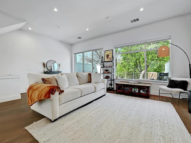 505 Tillery St Unit 6, Austin, TX 78702 - living area with dark wood-style floors, recessed lighting, and baseboards