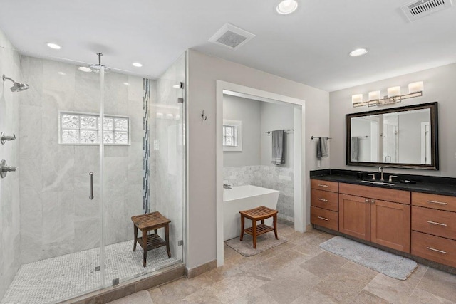 full bath with vanity, visible vents, recessed lighting, and a shower stall