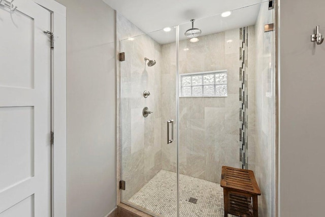 bathroom featuring recessed lighting and a shower stall