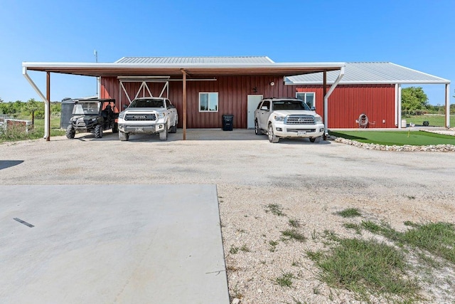 7993 W Fm 487, Florence, TX 76527 - view of parking featuring an area to practice putting, driveway, and a carport
