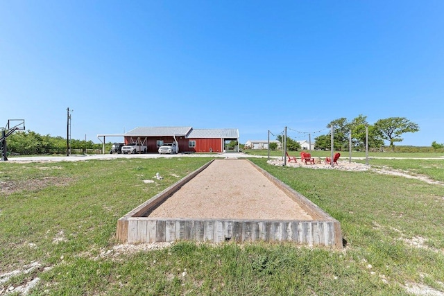 7993 W Fm 487, Florence, TX 76527 - view of green lawn with a carport and a bocce ball area