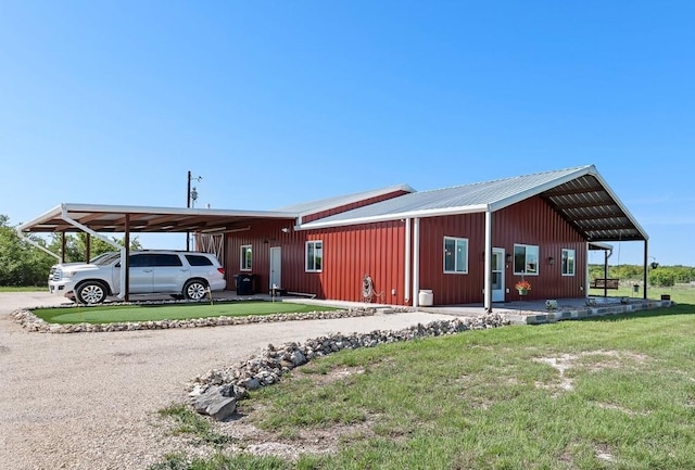 7993 W Fm 487, Florence, TX 76527 - view of front of property featuring a front yard, a metal roof, and driveway