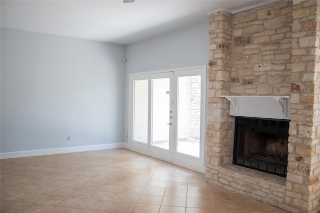 2201 Lakeway Blvd Unit 2, Lakeway, TX 78734 - unfurnished living room featuring tile patterned flooring and a stone fireplace