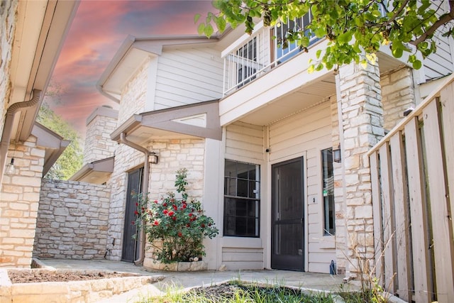 2201 Lakeway Blvd Unit 2, Lakeway, TX 78734 - entrance to property with a balcony and stone siding