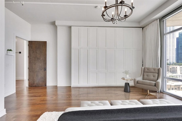 800 W 5th St Unit 1008, Austin, TX 78703 - bedroom featuring a chandelier and light wood-style flooring