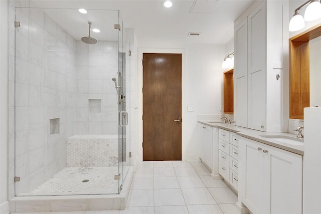 800 W 5th St Unit 1008, Austin, TX 78703 - bathroom with a shower stall, double vanity, tile patterned flooring, recessed lighting, and baseboards
