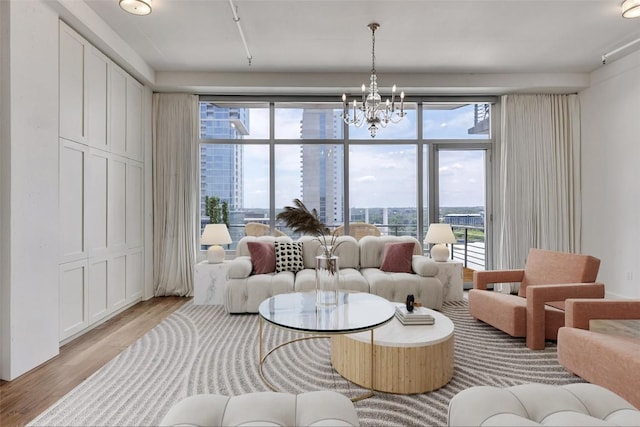 800 W 5th St Unit 1008, Austin, TX 78703 - living area with light wood finished floors and a chandelier