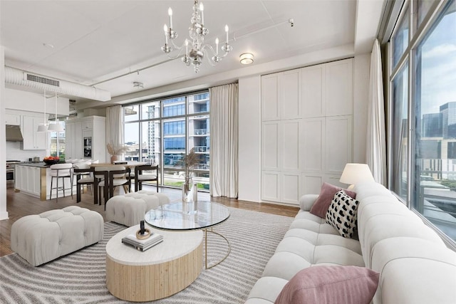 800 W 5th St Unit 1008, Austin, TX 78703 - living area featuring wood finished floors and a chandelier