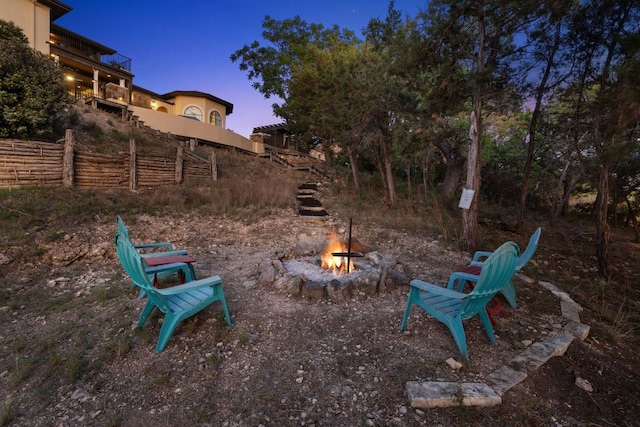 3708 Lajitas, Leander, TX 78641 - yard at dusk with an outdoor fire pit