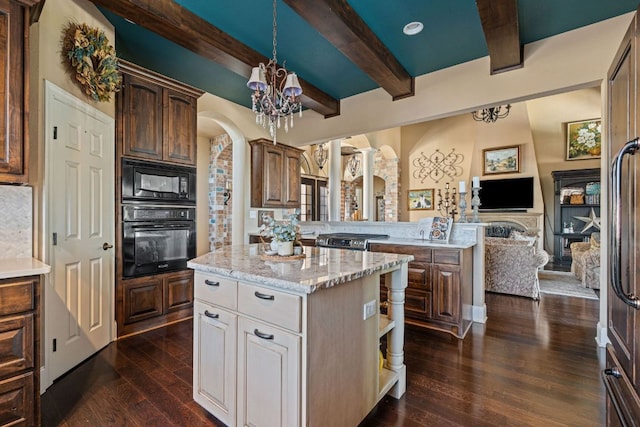 3708 Lajitas, Leander, TX 78641 - kitchen featuring black appliances, beam ceiling, arched walkways, a chandelier, and dark wood finished floors