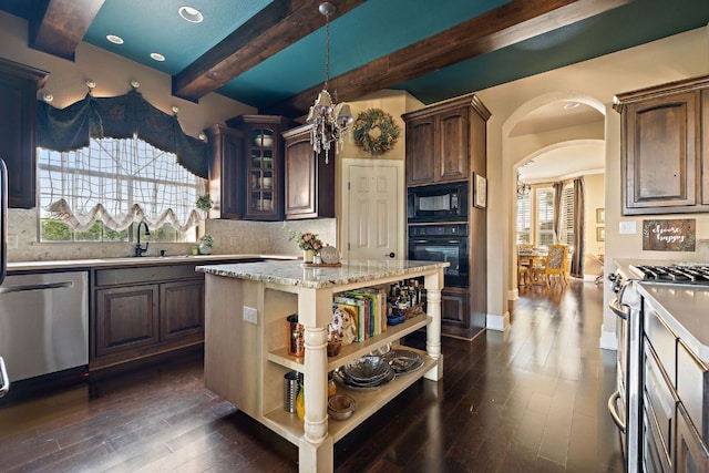 3708 Lajitas, Leander, TX 78641 - kitchen with black appliances, open shelves, dark wood-style floors, beamed ceiling, and arched walkways