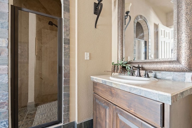 3708 Lajitas, Leander, TX 78641 - full bathroom with a textured wall, a shower stall, and vanity
