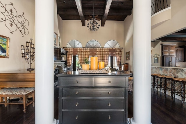 3708 Lajitas, Leander, TX 78641 - bar featuring decorative columns, wood finished floors, a wooden ceiling with exposed beams, decorative backsplash, and a towering ceiling