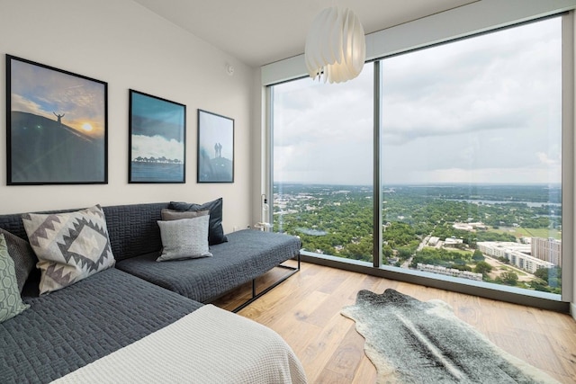 44 E Ave Unit 4305, Austin, TX 78701 - living room with plenty of natural light, expansive windows, and wood finished floors