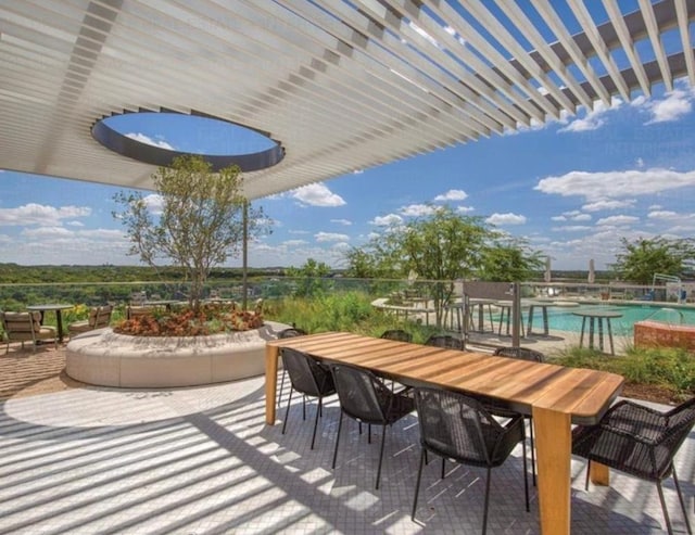 44 E Ave Unit 4305, Austin, TX 78701 - view of patio / terrace with outdoor dining space and a community pool
