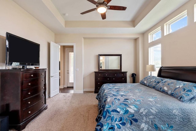 629 Asher Ct, Leander, TX 78641 - carpeted bedroom with a raised ceiling and ceiling fan