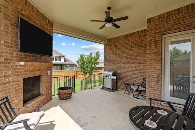 629 Asher Ct, Leander, TX 78641 - view of patio featuring an outdoor brick fireplace, grilling area, and ceiling fan