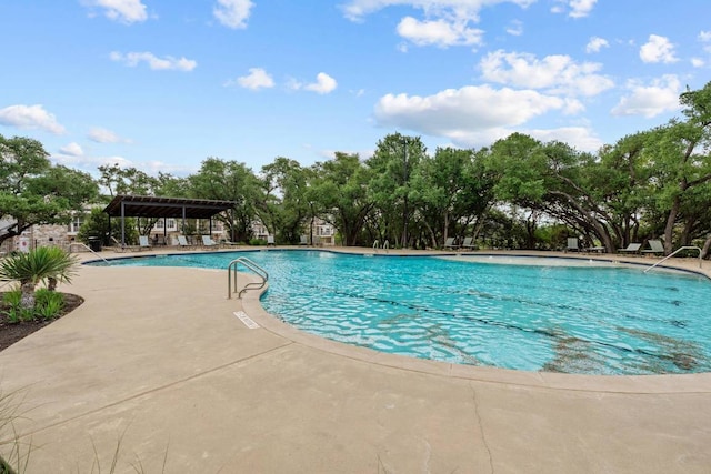 629 Asher Ct, Leander, TX 78641 - community pool with a patio area and view of scattered trees