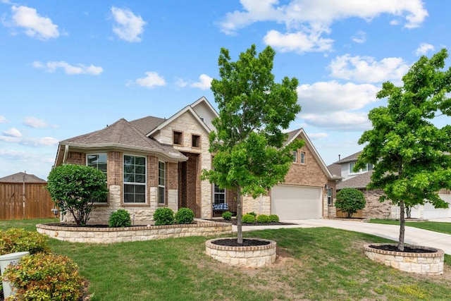 629 Asher Ct, Leander, TX 78641 - view of front of house featuring stone siding, driveway, a garage, brick siding, and a shingled roof