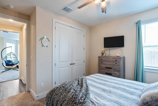 629 Asher Ct, Leander, TX 78641 - bedroom with a closet, ceiling fan, and carpet flooring