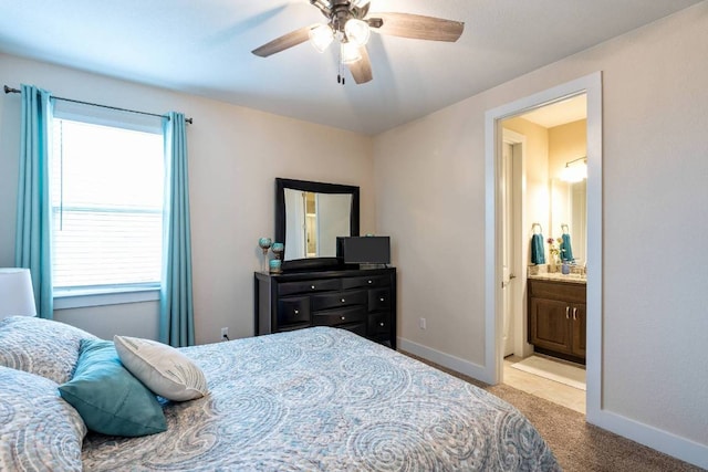 629 Asher Ct, Leander, TX 78641 - carpeted bedroom with a ceiling fan and connected bathroom