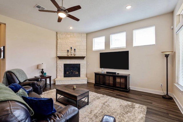 629 Asher Ct, Leander, TX 78641 - living area with a ceiling fan, dark wood-style flooring, a fireplace, and recessed lighting