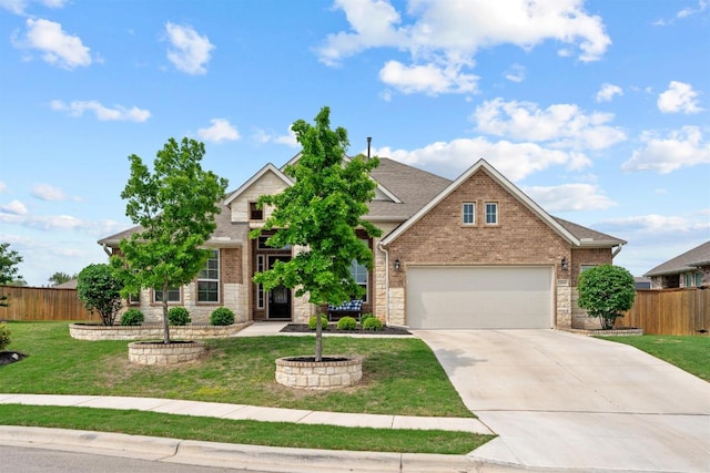 629 Asher Ct, Leander, TX 78641 - view of front of property featuring concrete driveway, a garage, brick siding, and a shingled roof