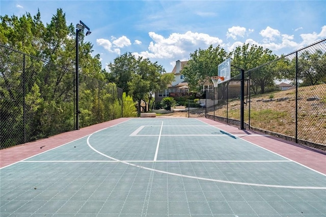 view of sport court featuring community basketball court and fence