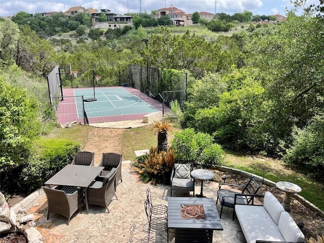 view of sport court with fence