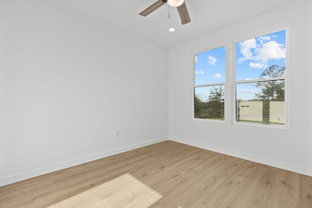208 Ulupau Cir, Bastrop, TX 78602 - unfurnished room featuring baseboards, light wood finished floors, ceiling fan, and recessed lighting