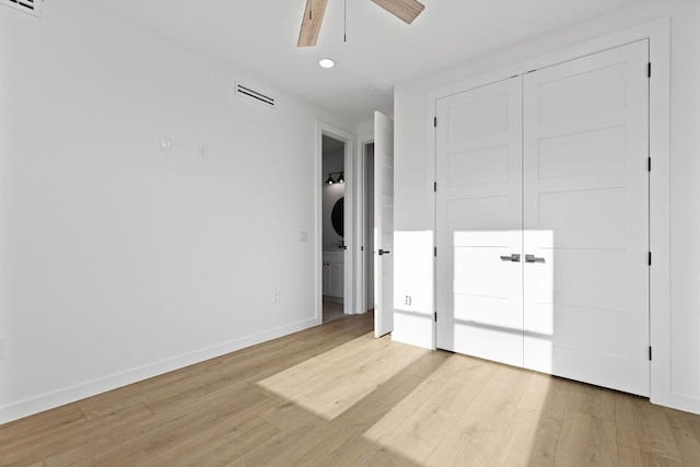 208 Ulupau Cir, Bastrop, TX 78602 - unfurnished bedroom featuring recessed lighting, light wood-type flooring, baseboards, ensuite bath, and ceiling fan