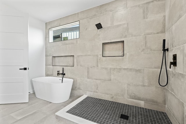208 Ulupau Cir, Bastrop, TX 78602 - full bath with tiled shower and a freestanding tub