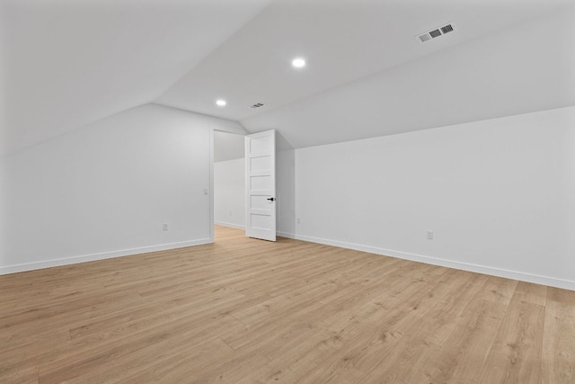 208 Ulupau Cir, Bastrop, TX 78602 - additional living space with lofted ceiling, light wood-style flooring, and recessed lighting