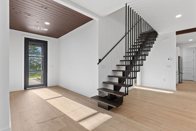 208 Ulupau Cir, Bastrop, TX 78602 - staircase featuring wood finished floors, recessed lighting, and wooden ceiling