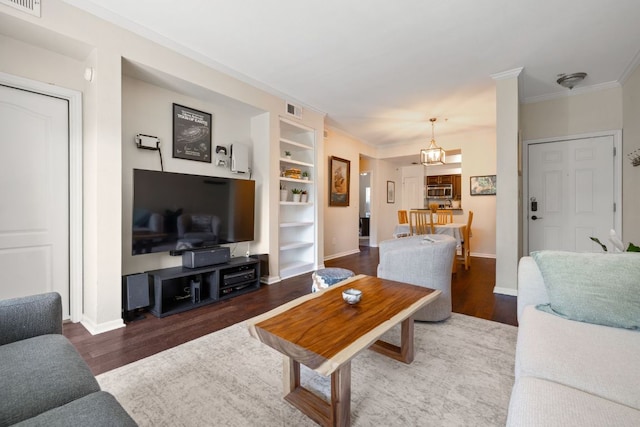 6000 Shepherd Mountain Cv Unit 302, Austin, TX 78730 - living room with wood finished floors, built in features, baseboards, and crown molding