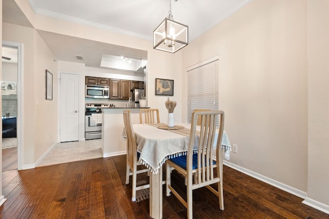 6000 Shepherd Mountain Cv Unit 302, Austin, TX 78730 - dining space with a chandelier, wood-type flooring, baseboards, and crown molding