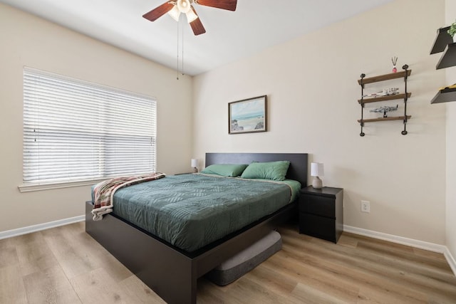 6000 Shepherd Mountain Cv Unit 302, Austin, TX 78730 - bedroom with multiple windows, light wood-style floors, and baseboards