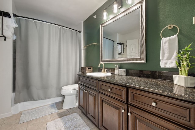 bathroom featuring shower / bathtub combination with curtain, toilet, vanity, and tile patterned floors