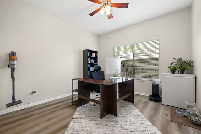 6000 Shepherd Mountain Cv Unit 302, Austin, TX 78730 - home office with a ceiling fan, wood finished floors, and baseboards
