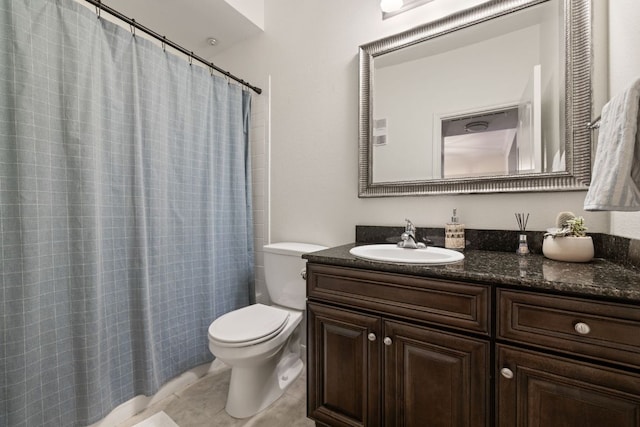 full bath featuring curtained shower, vanity, tile patterned flooring, and toilet